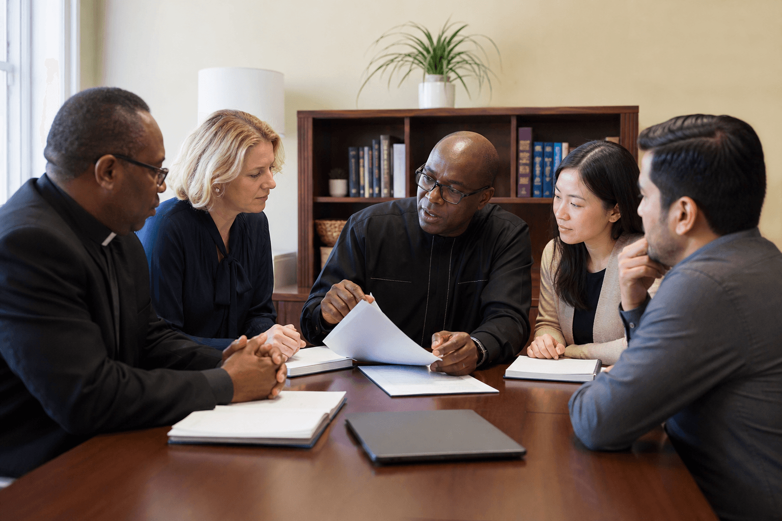 Diverse church leadership team meeting respectfully with community members