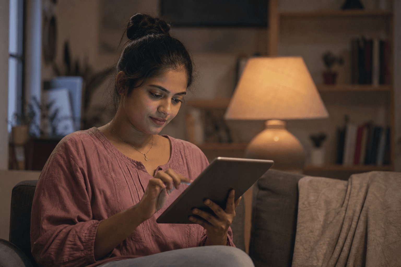 Person thoughtfully setting faith preferences on a tablet at home